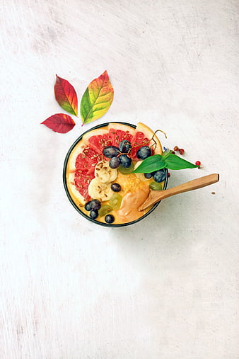 Top View of Colorful Fruit Oatmeal Bowl with Spoon