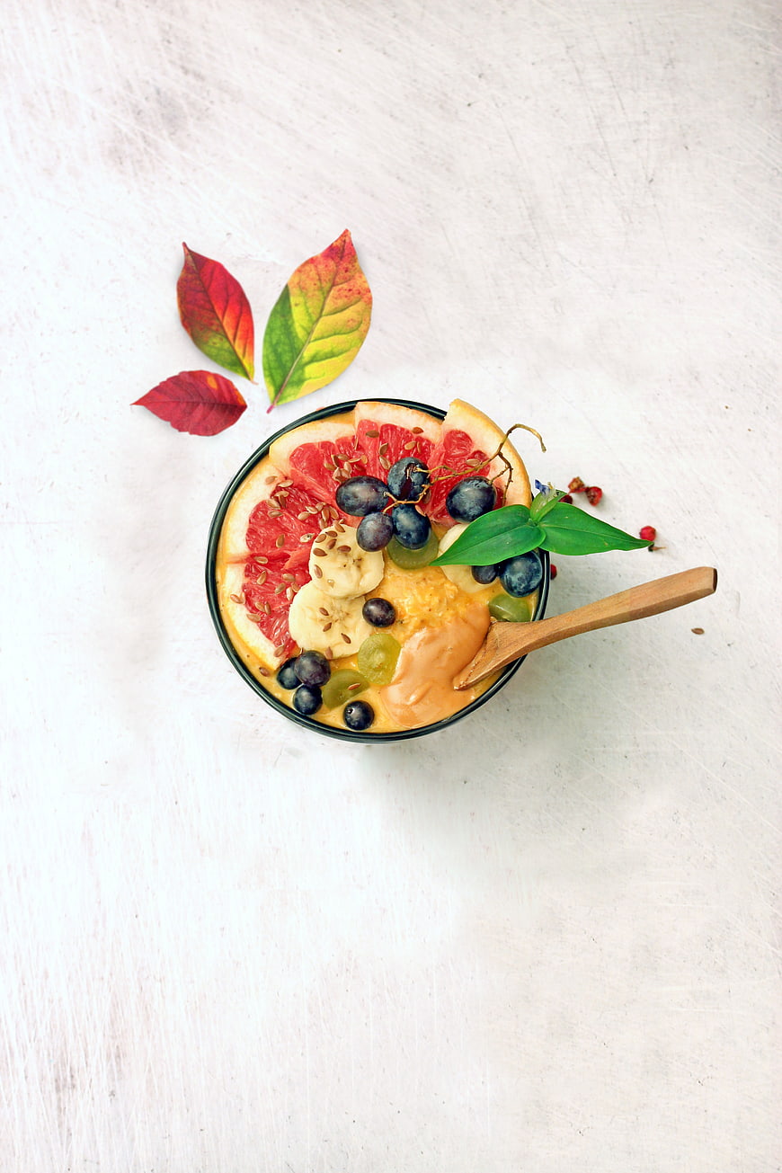 Top View of Colorful Fruit Oatmeal Bowl with Spoon