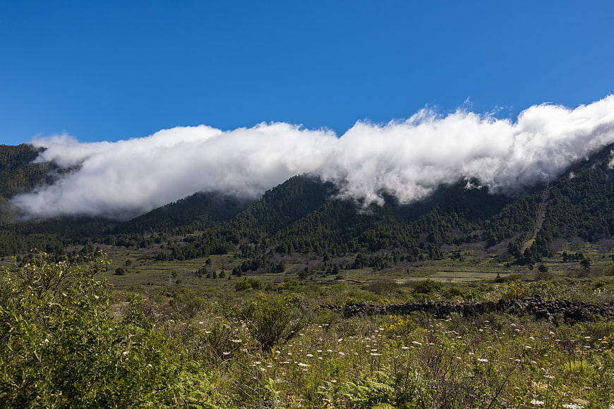 Misty Mountain Landscape with Clouds and Green Valley