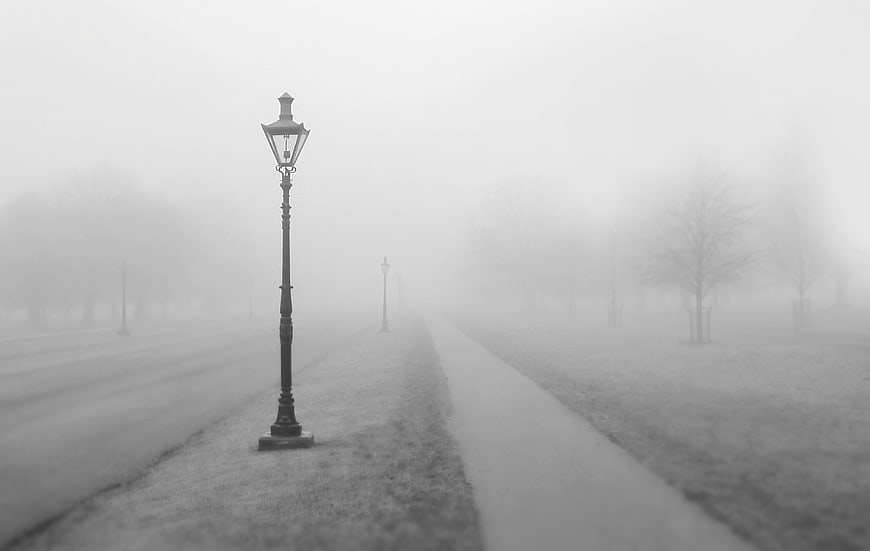 Vintage Lamp Post in Foggy Park Path