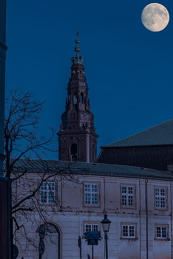 Full moon over Copenhagen church tower at night