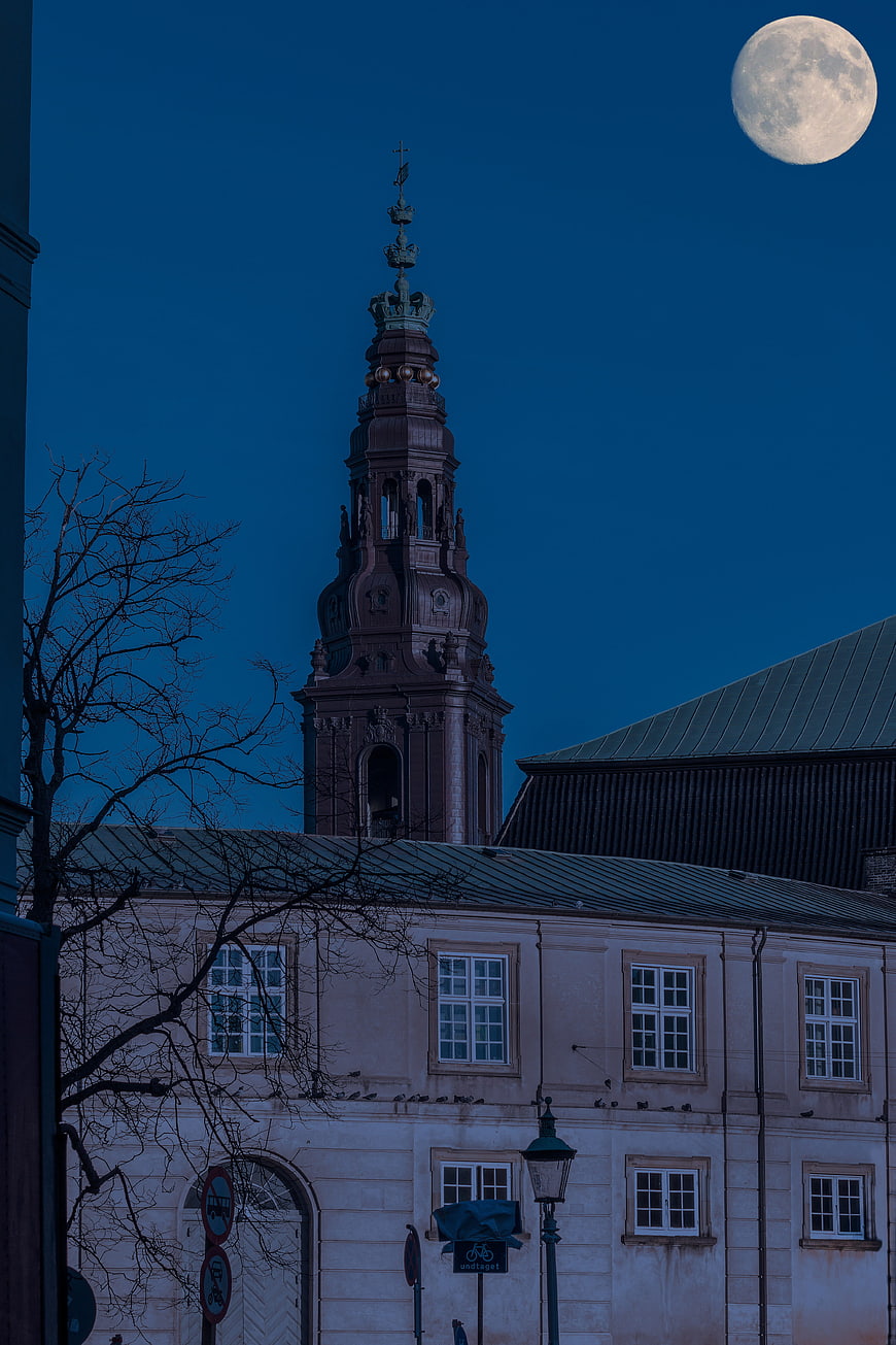 Full moon over Copenhagen church tower at night