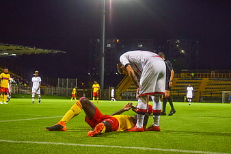 Soccer player injured on field at night