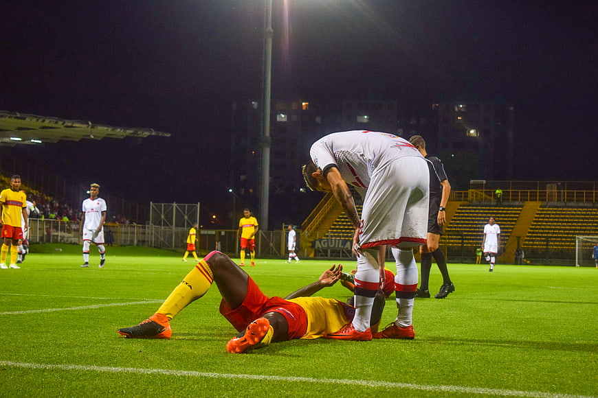 Soccer player injured on field at night