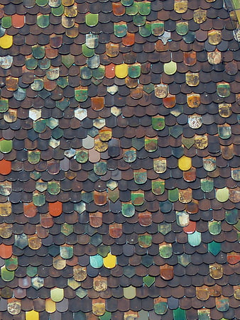 Close-up of multicolored medieval roof tiles on the Butcher's Tower in Ulm, Germany