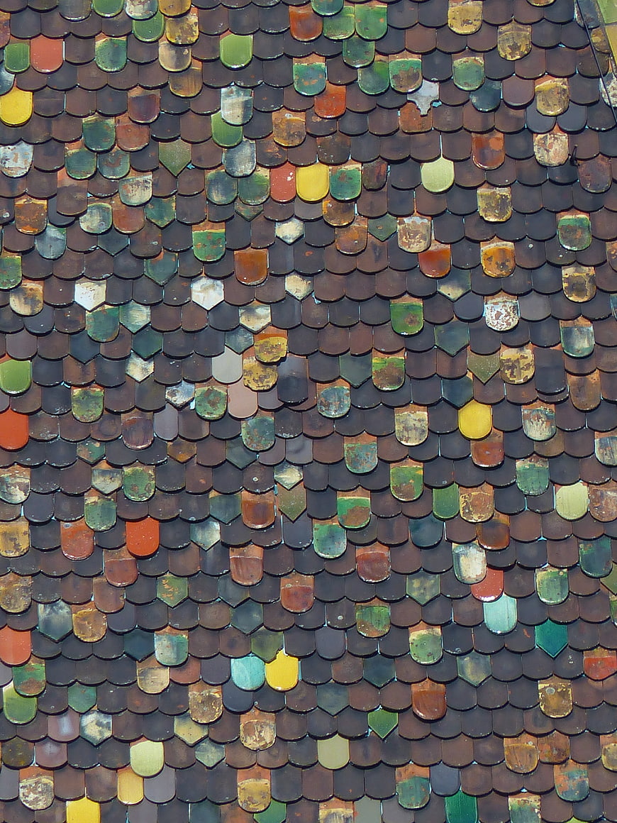 Close-up of multicolored medieval roof tiles on the Butcher's Tower in Ulm, Germany