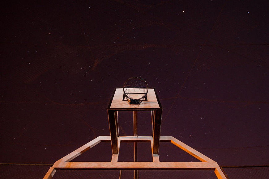 Minimalist Basketball Hoop Against Starry Night Sky