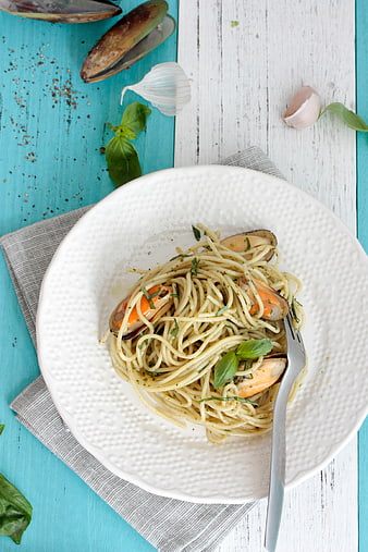 Top View of Spaghetti with Mussels on Blue Wooden Table