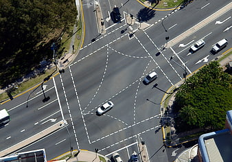 Aerial View of Urban Road Intersection with Traffic and Lane Markings