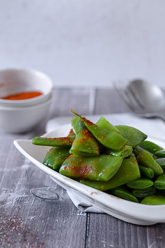 Seasoned Broad Beans in White Bowl on Wooden Table