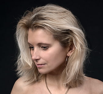 Studio Portrait Of A Blonde Woman With Textured Hair