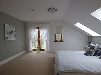 Bright Modern Bedroom with Skylights and White Curtains