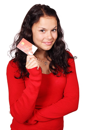 Young woman holding credit card isolated on white background