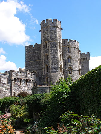 Windsor Castle stone tower and turret with lush green garden