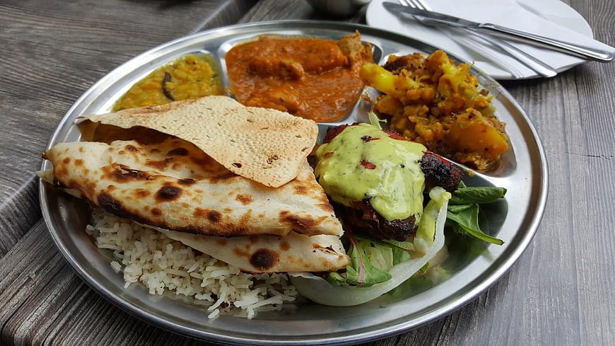 Traditional Indian Thali Meal on Metal Plate