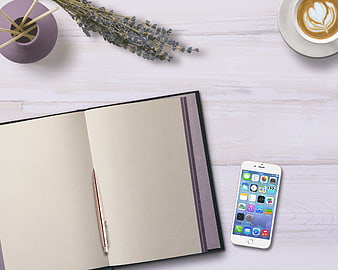Flat lay workspace with open notebook, smartphone, and coffee