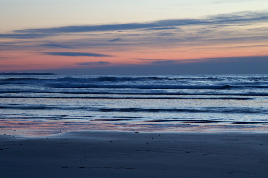 Serene Ocean Sunset with Pink and Blue Sky Reflections