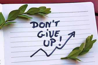 Don't Give Up Handwritten Note With Green Leaves On Lined Notebook