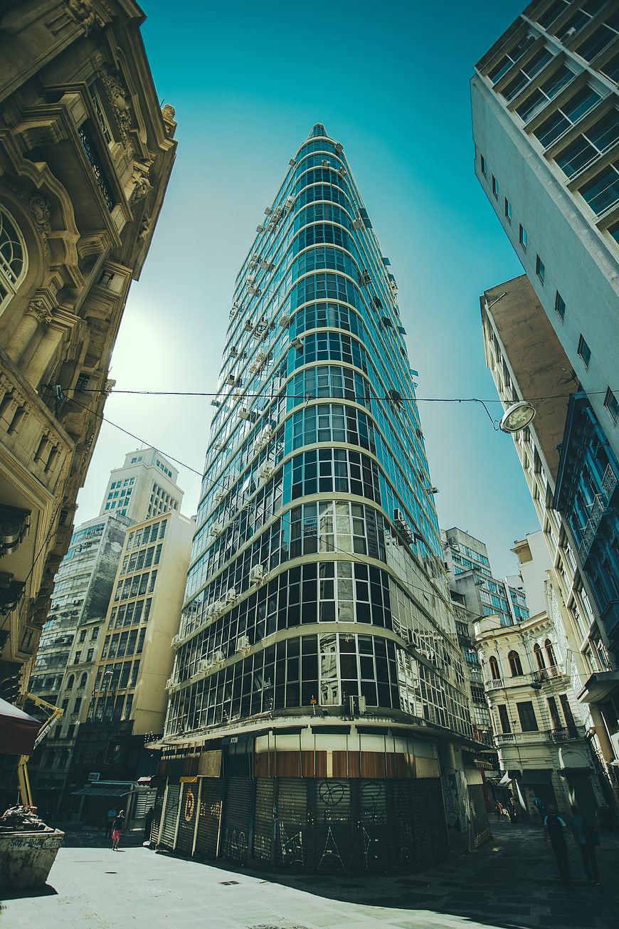 Low angle view of modern glass skyscraper in urban city