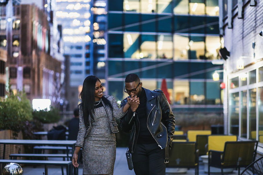 Happy African American Couple Walking in City at Night