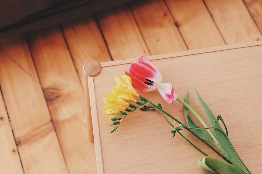 Pink and Yellow Tulips on Wooden Tray