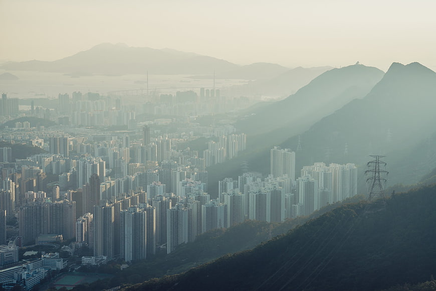 Hazy Morning View of Hong Kong Cityscape and Mountains
