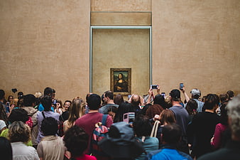 Crowd of Tourists Taking Photos of the Mona Lisa at the Louvre Museum