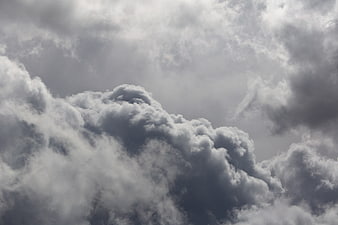 Dramatic dark storm clouds in a moody gray sky