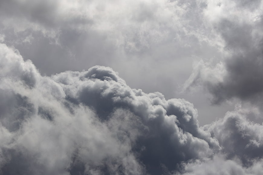 Dramatic dark storm clouds in a moody gray sky
