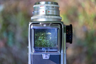 Close-up of Vintage Hasselblad Camera Lens in Forest