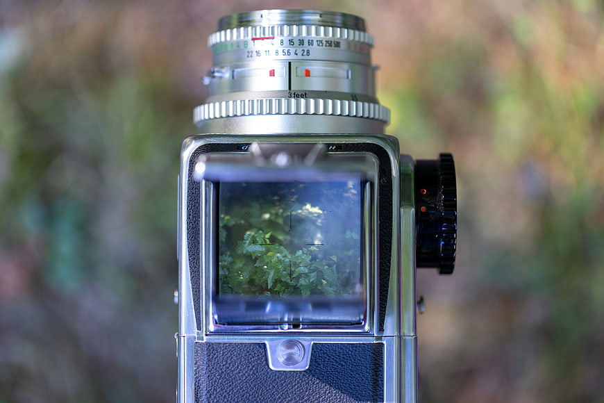 Close-up of Vintage Hasselblad Camera Lens in Forest