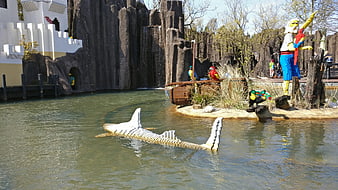 Lego shark sculpture swimming in water park lagoon