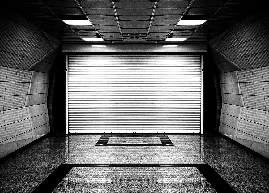 Symmetrical Black and White View of Closed Metal Garage Door