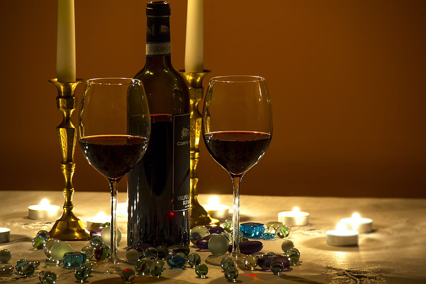 Romantic Red Wine Bottle and Glasses with Candles and Glass Beads
