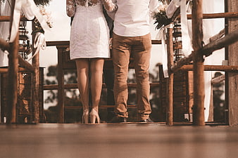 Wedding Couple Standing at Rustic Altar Ceremony