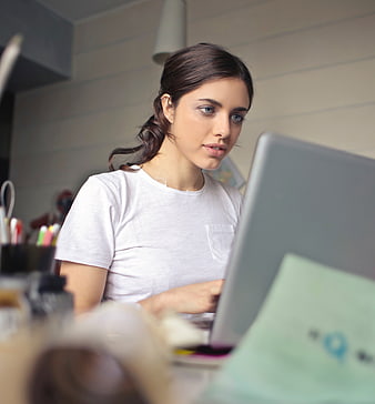 Young woman working on laptop in home office