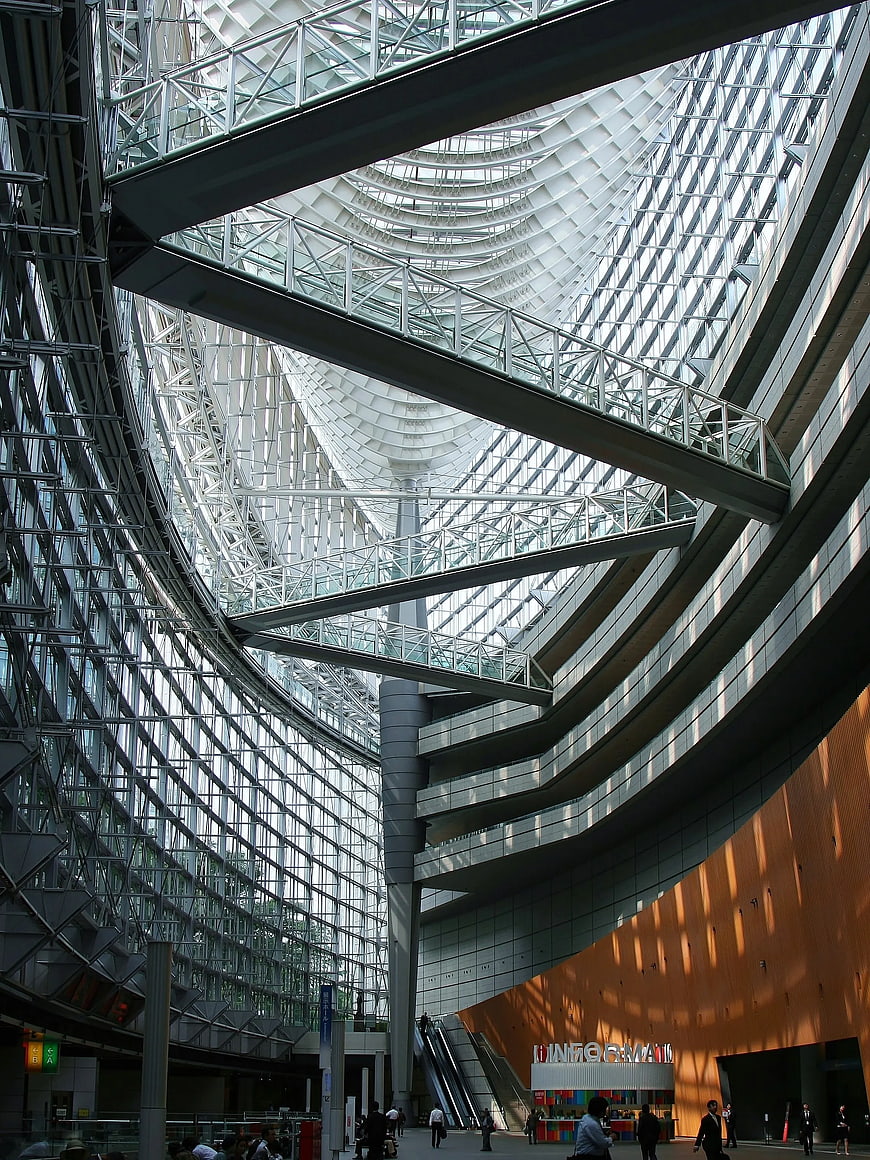 Modern Glass Atrium with Curved Architecture and Steel Beams