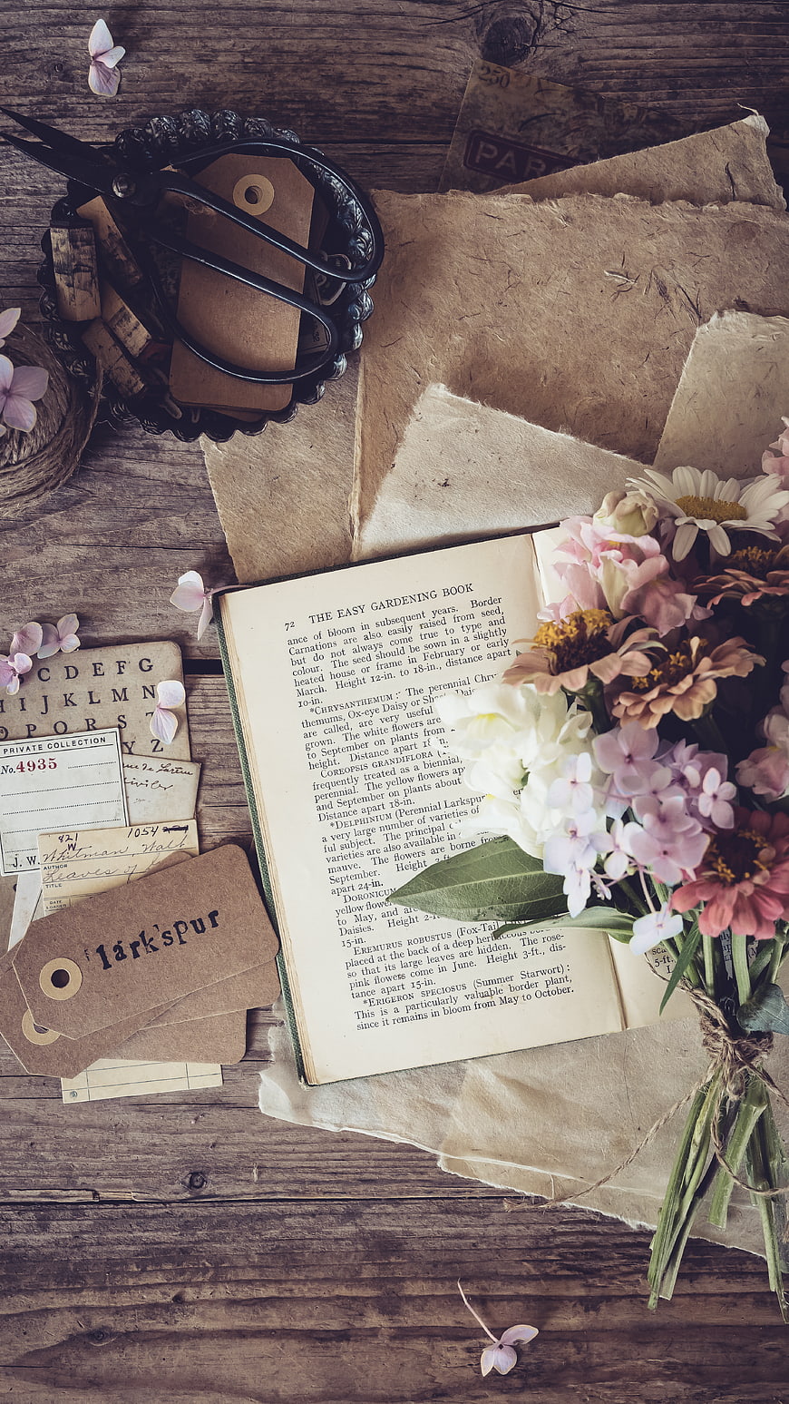 Vintage gardening book with flowers and rustic supplies