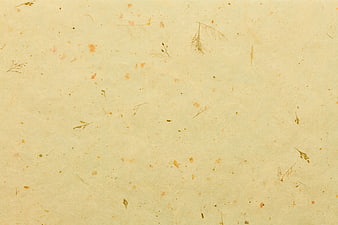 Textured handmade paper background with plant fibers