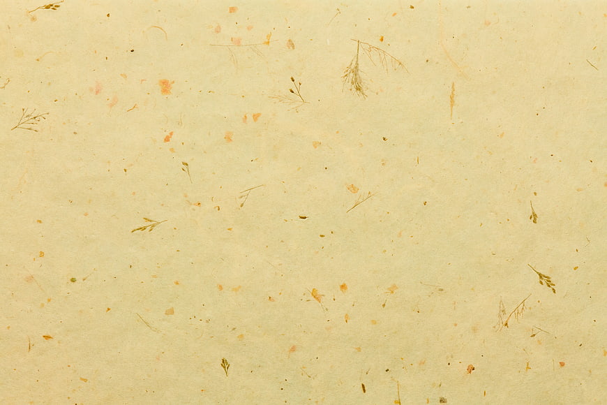 Textured handmade paper background with plant fibers