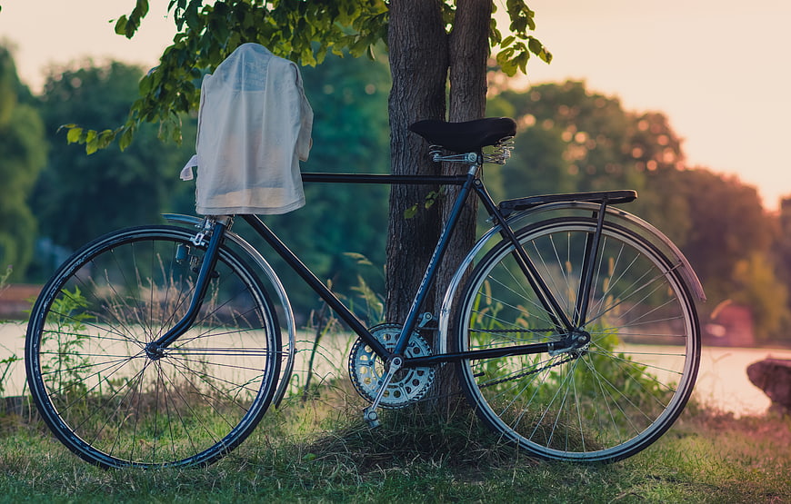 Vintage Bicycle with Shirt Drying in Park at Sunset