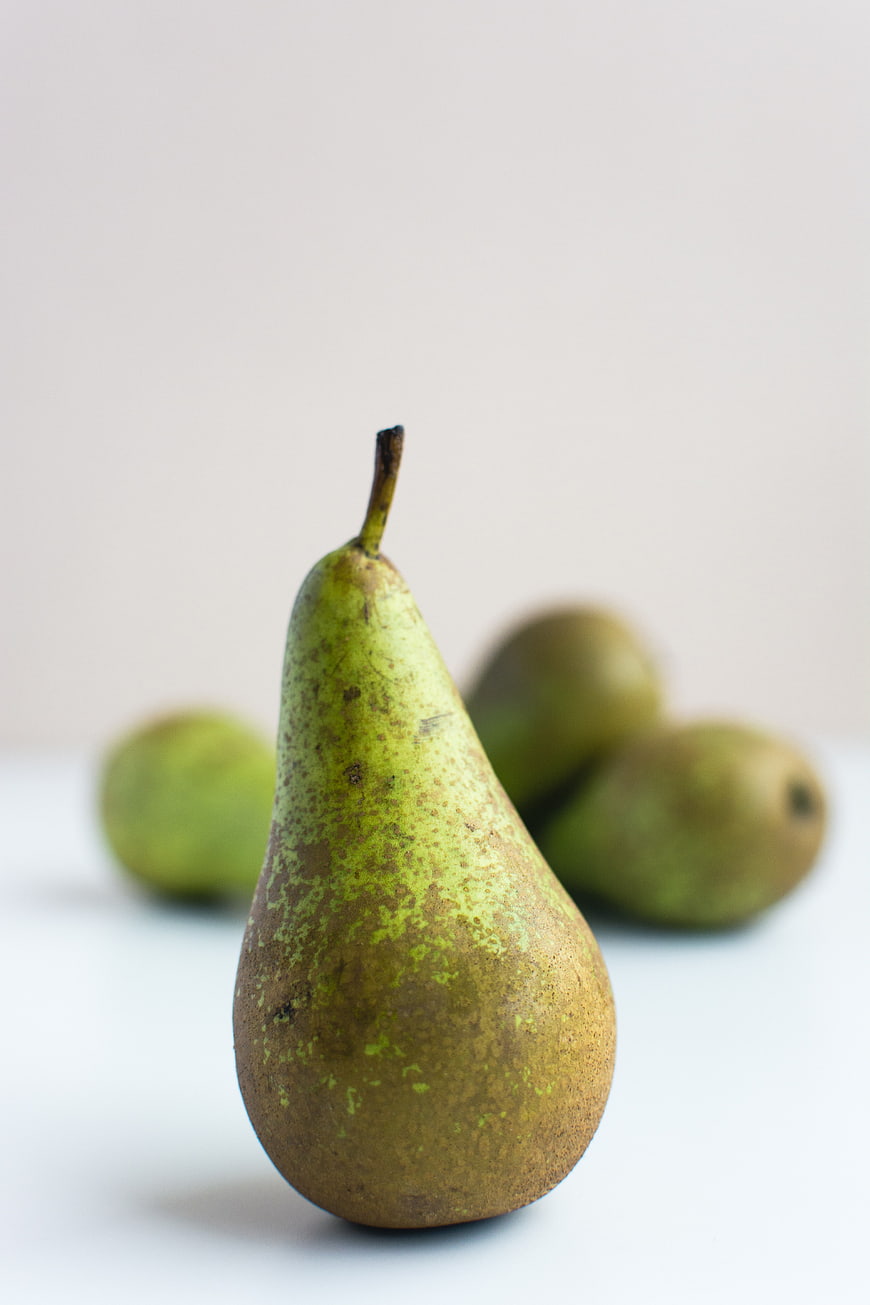 Fresh Green Pear Close-Up on White Background
