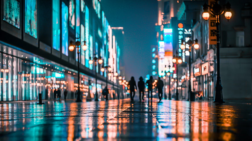 Cyberpunk City Street at Night with Silhouettes and Neon Reflections