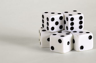 White Dice Stacked On Light Gray Background