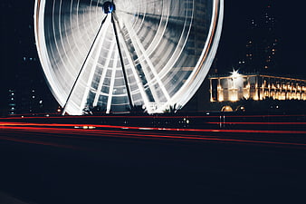 Long Exposure Night Photography of Illuminated Ferris Wheel
