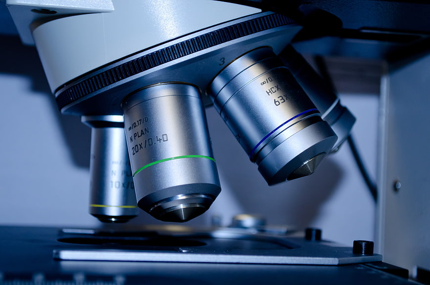 Close-up of microscope objective lenses in a laboratory