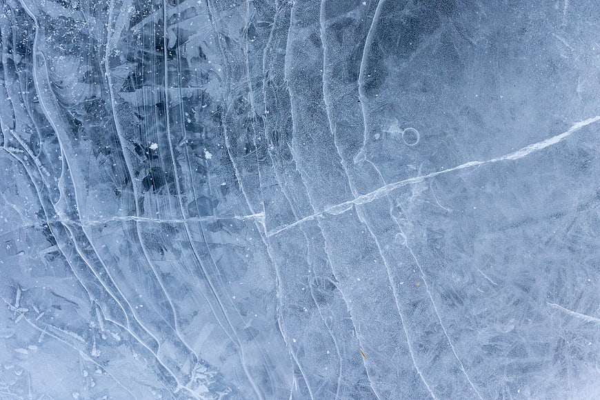 Abstract Blue Ice Texture with Cracks and Frozen Patterns