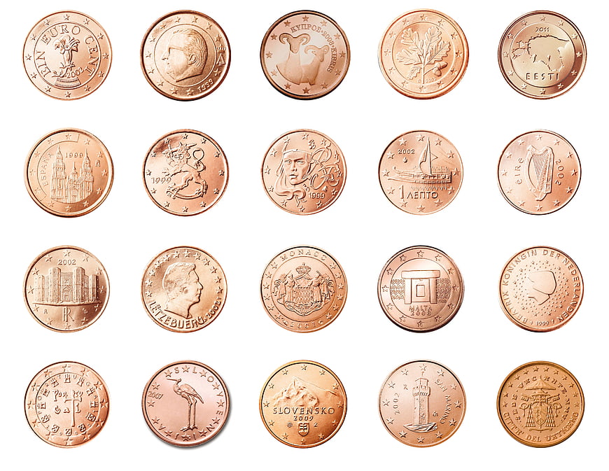 Grid of various European 10 cent euro coins on white background