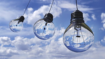 Three Hanging Light Bulbs Against Blue Sky with Clouds