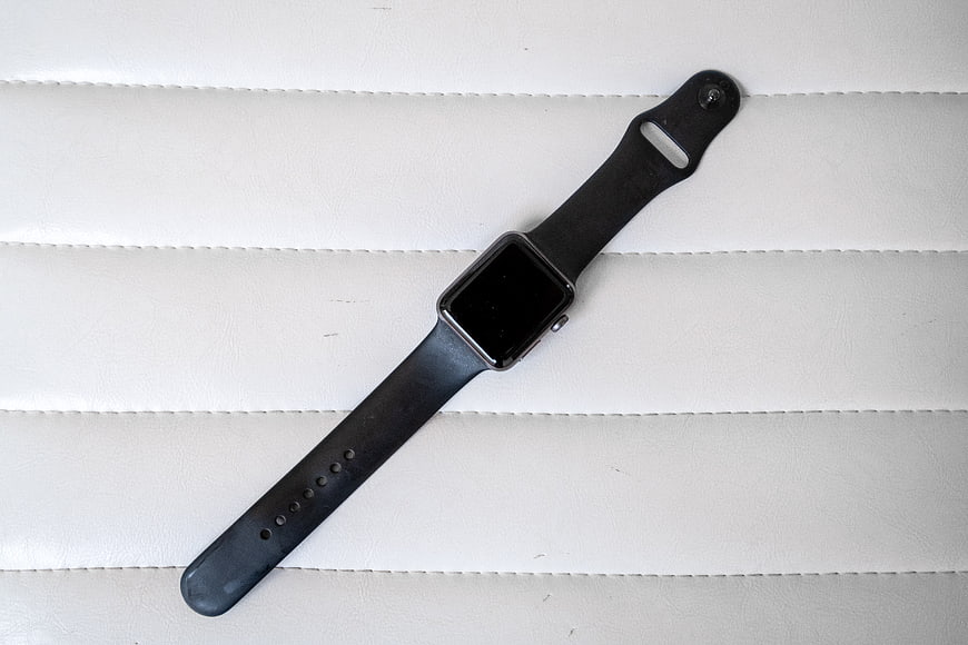 Black Smartwatch on White Leather Background